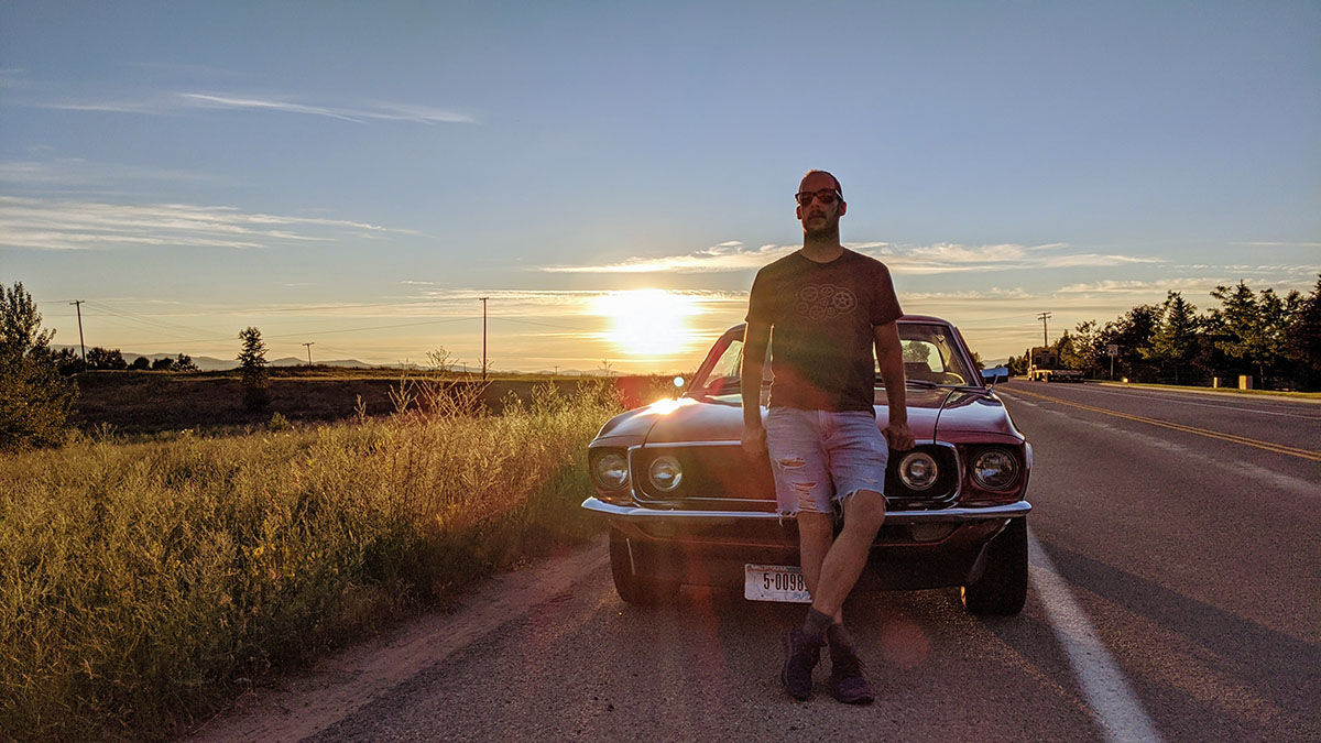 Montana - Michael Makarov is posing by his friend's car.