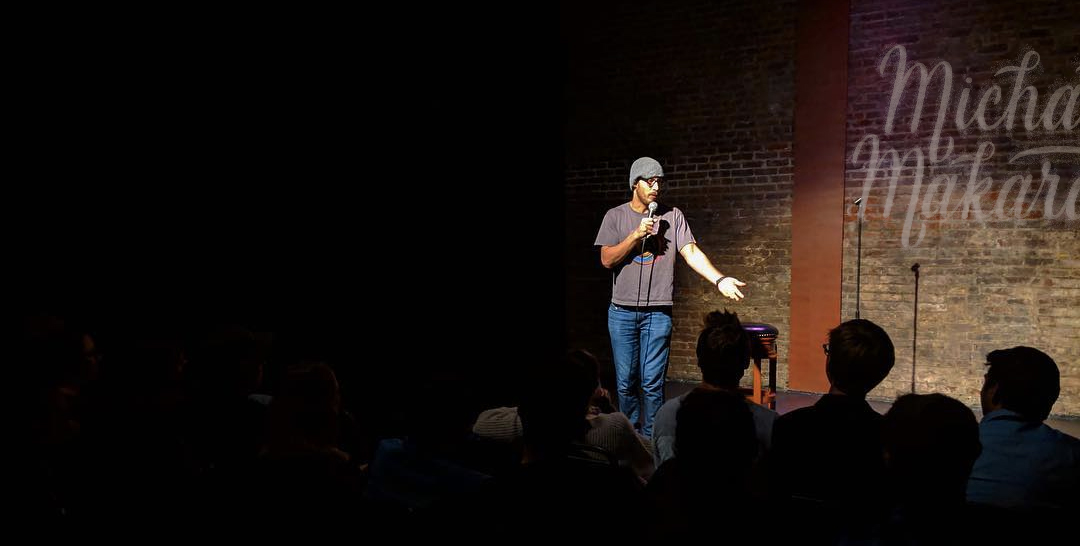 Michael Makarov performs stand-up comedy in Exit theater.