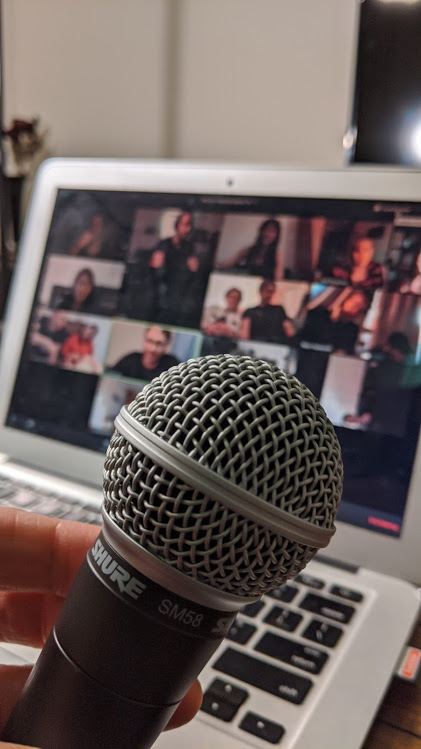 Michael Makarov - Comedy show online - microphone in front of the screen.